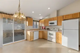 Kitchen and dining space open to private western patio