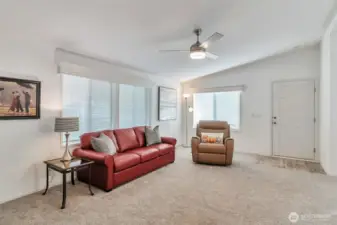 Step in the front door to a welcoming and open living area.  Cornice boards trim on windows with blinds throughout.