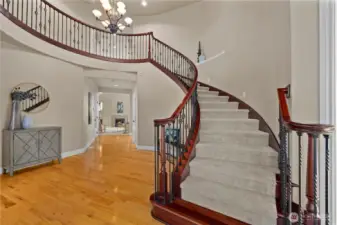 Enter to a grand curved staircase.