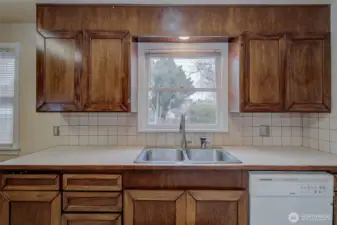 Enjoy the pool view while washing dishes