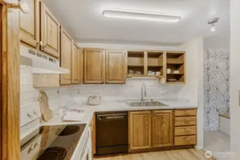 Updated countertops, tile backsplash, sink and lighting in the kitchen