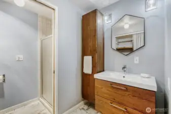 New vanity, tile floor and lighting in primary bath