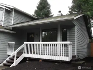 Inviting, covered front porch perfect for having your morning coffee!
