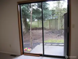Sliders access the backyard patio.