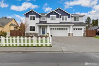 White picket fence living at its finest. Driveway fits 4+ in addition to 3 car garage