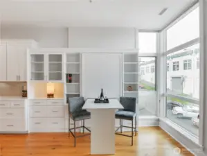 View of Murphy bed that converts to multiple use table/desk/workspace/dining.