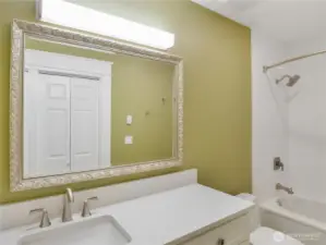 Primary bdrm full bath w/Quartz counter & heated tile floor.