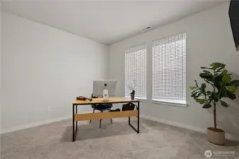 main floor office/bedroom with closet