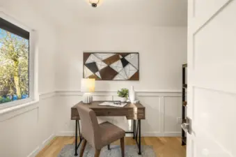 The main level features a cozy office space with luxury finishes hinted throughout