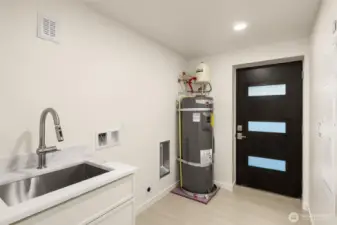Lastly the basement features a full mudroom with laundry hookup - backyard access too