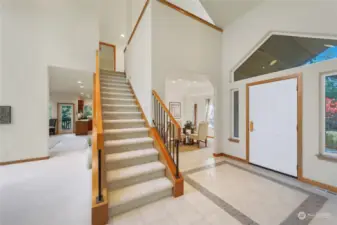 Back to the entryway of the home, stairs invite you to reveal the upstairs.