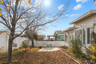 Fenced back yard! The enclosed back patio has a pet door for your little furry friend.