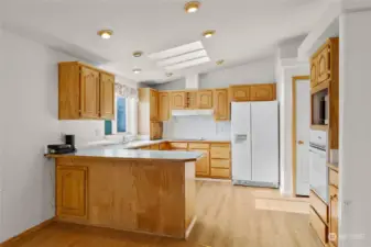 Kitchen with cute island for more counterspace. Skylights for nice natrual light! Dedicated pantry area.