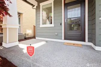 Start your welcome home experience with a beautiful washed aggregate cement front porch.