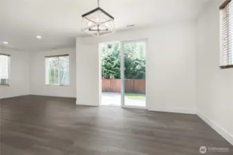 Open dining area with easy access to the backyard, blending indoor and outdoor living.