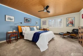 Bedroom with large windows providing ample natural light throughout.