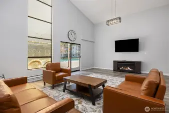 Additional entertainment room in clubhouse leading to pool area through sliding glass doors.