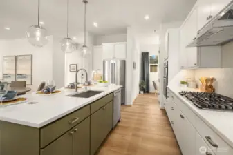 Kitchen with pendant lighting and gas cooktop.Photos are for illustrative purposes