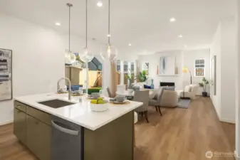 Kitchen Island and great room.  Photos are for illustrative purposes