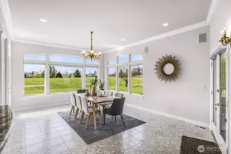 Dining Room surrounded on all sides by windows
