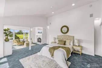 Main floor Primary Bedroom Suite with separate sitting room and fireplace