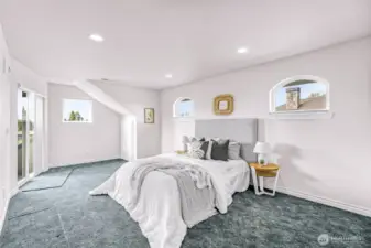Upstairs Bedroom (3 total bedrooms upstairs including den). Slider leads to outdoor deck.
