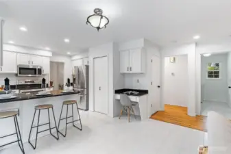 Convenient planning desk off the kitchen and a pantry for added storage.