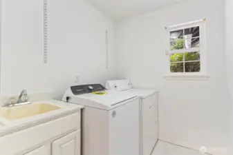 Laundry room with convenient sink.
