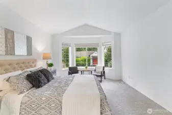 Primary bedroom boasts a bay window with sitting area and a 5 piece private bath.