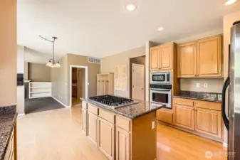 The abundant cabinets, counterspace and the island create a wonderful kitchen to create meals together.
