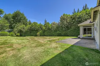 The landscaping around this wonderful, level yard is well-manicured and provides total seclusion.