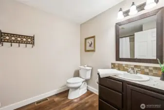 Spacious full guest bathroom with plenty of room and functional layout.