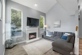 Vaulted ceilings in the living room with lots of light and enjoy the cozy fireplace in those winter months