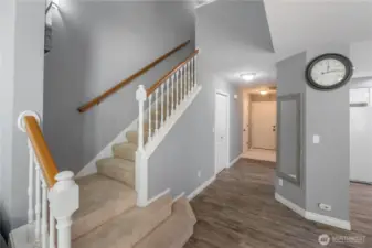Stairs with fan leading to second floor
