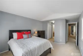 Primary bedroom with bath and dual closets