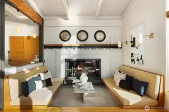 A cozy spot around the fireplace with the built-in benches.