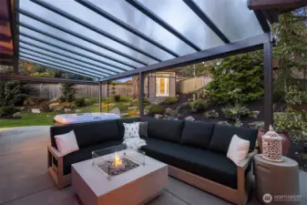 In the background, the gardening shed could potentially be turned into a home office.