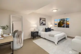 The ground level offers 3 spacious bedrooms. This one is a second ensuite with a sizable walk-in closet. Potentially this room could be used as a workout space/guest bedroom with a Murphy bed.