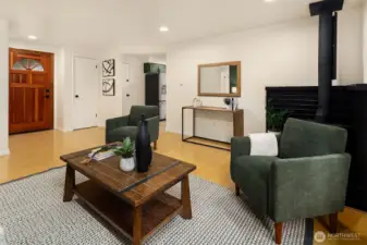 Living room flowing seamlessly into kitchen space.