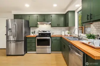 Spacious kitchen offering ample storage.