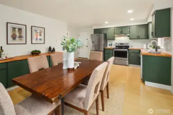 Dining room showcasing additional kitchen storage.