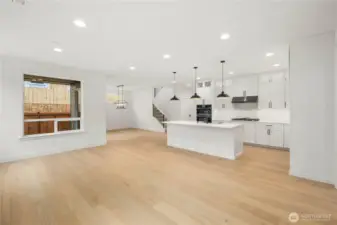 The great room’s expansive footprint connects seamlessly with the kitchen and dining area, enhanced by natural light from oversized windows. With room for multiple seating zones, this open concept is designed for easy entertaining and everyday comfort.    These photos are from lot 3 at Gooden Hollow, the actual home for sale. However, other homes may vary, so all photos, renderings, site maps, and floorplans are for visualization purposes only. Plans, colors, building orientation, finishes, home outlook, and other details can and WILL vary.