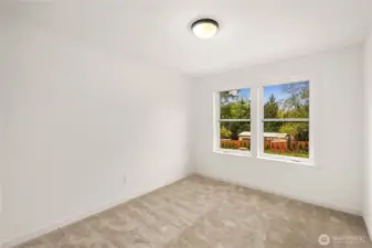 A comfortable upper-level bedroom with soft natural light, plush carpeting, and a simple, flexible footprint. It’s well-suited for a bedroom, office, or guest space depending on your needs.    These photos are from lot 3 at Gooden Hollow, the actual home for sale. However, other homes may vary, so all photos, renderings, site maps, and floorplans are for visualization purposes only. Plans, colors, building orientation, finishes, home outlook, and other details can and WILL vary.