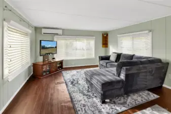 Living room facing south and the driveway has territorial Chuckanut Mountain views. Three big window face East, South and West for all-day light.