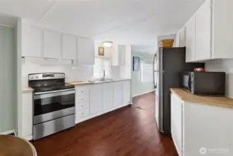 Kitchen with newer stove/oven and refrigerator