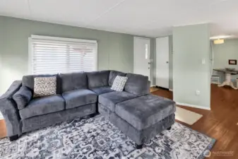 Living room facing West. There is a convenient coat closet by the front door.