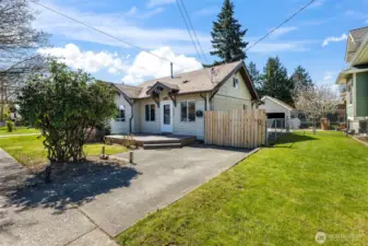 Long gated driveway leads to a oversized four car detached garage.