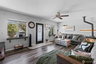 plenty of windows and a glass framed front door allow the space to enjoy the natural light.