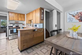 Off the kitchen you will find the stairway leading to the two bedrooms upstairs.