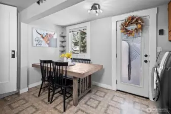 Small dining space off the kitchen and access to the covered back deck.